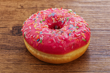 Sweet glazed struwberry donut with icing