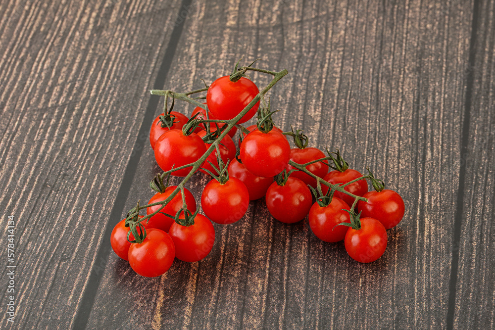 Wall mural ripe sweet cherry tomato branch