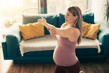 Pregnant Woman Relaxing In The Living Room