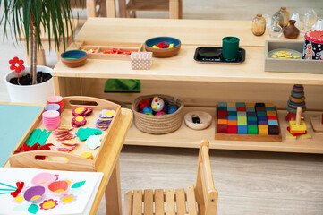 Classroom of Montessori kindergarten. The colorful Montessori material. Concept of children...