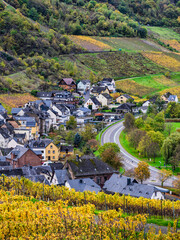 Senheim village between steep vinyards and rolling hills during autumn in Cochem-Zell district, Germany in Cochem-Zell district, Germany