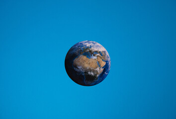 planet earth seen from afar on a blue dark background