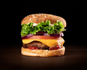 This photograph features a juicy vegan burger on a black background, resting on a wooden table. The burger is topped with melted cheese, lettuce, onion, vegan steack, mayonese, ketckup and tomato.