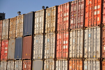 Fototapeta premium Rijeka,Croatia, February 2023.Stack of containers in a harbor. Plenty of varicolored shipping containers stacked at the Port of Rijeka.