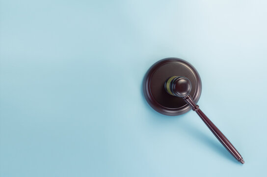 Gavel on blue background view from the top with  space for text, legislation symbol