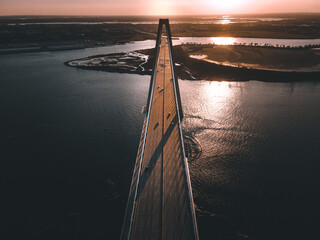 Obraz premium Aerial view of the Arthur Ravenel Jr. Bridge during sunrise.