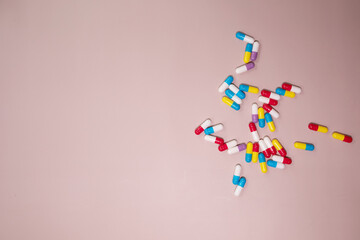Different pills on beige background, flat lay. 