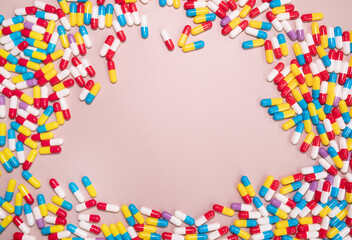 Medicine pills, tablets, capsules frame over beige background. Copy space. Pharmacy industry concept.