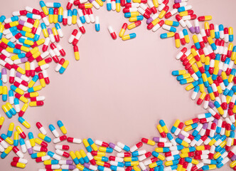 Medicine pills, tablets, capsules frame over beige background. Copy space. Pharmacy industry concept.