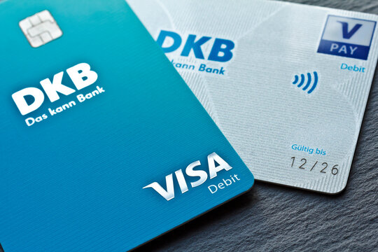 Hamburg, Germany - February 28 2023: Close-up of VISA direct debit cards of the german DKB bank on dark background, EDITORIAL USE ONLY.