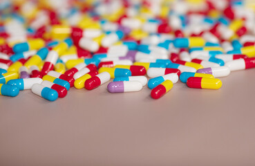 Different pills on beige background, flat lay. 