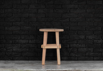 wooden rustic stool on a wooden floor