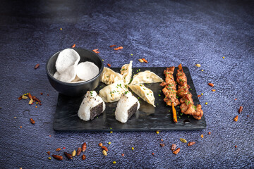 Oriental food as sushis and chinese chips