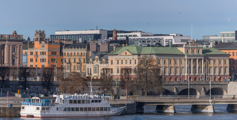 Naklejka premium Panorama. The bay Strömmen, commuter boat, bridge, Department of Foreign Affairs, the Prime minister building Sagerska Palatset, a sunny spring day in Stockholm