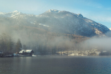 Fog covered winter lake Bohinj in beautiful Slovenia