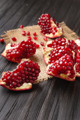 Sliced pomegranate on a dark background