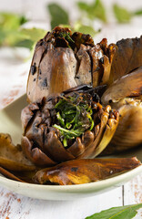 Grilled artichokes seasoned with olive oil
