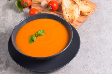 Tomato soup with basil.  Healthy, vegan and dieting lunch and dinner concept. Gazpacho. 