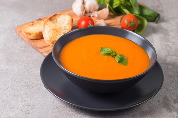 Tomato soup with basil.  Healthy, vegan and dieting lunch and dinner concept. Gazpacho. 