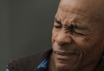 man suffering from deafness and hearing loss with people stock image stock photo	
