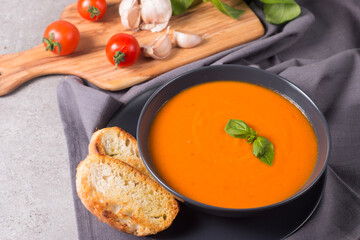 Tomato soup with basil.  Healthy, vegan and dieting lunch and dinner concept. Gazpacho. 