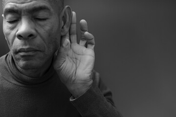 suffering from deafness and hearing loss on grey background with people stock photo	