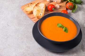 Tomato soup with basil.  Healthy, vegan and dieting lunch and dinner concept. Gazpacho. 