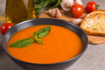 Tomato soup with basil.  Healthy, vegan and dieting lunch and dinner concept. Gazpacho. 