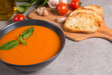 Tomato soup with basil.  Healthy, vegan and dieting lunch and dinner concept. Gazpacho. 