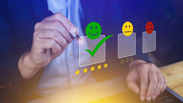 Businessman choosing happy smile face icon. feedback rating and positive customer review experience, satisfaction survey. mental health assessment.