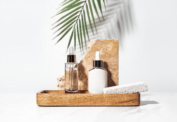 Wooden tray with beauty cosmetic products decorated with travertine stone tile.
