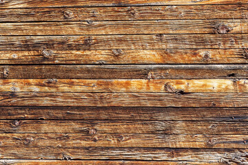 Unpainted wooden wall with horizontal planks