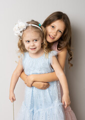 Two sisters in dresses