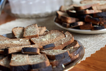 A slice of rye bread, greased with grated garlic