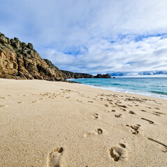 Sunny day in Porthcurno beach Cornwall, England February 2023.