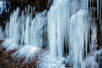 Long, pointed icicles draped on a cliff in Connecticut.