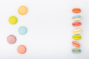 Macaroons, baked sweets from the pastry shop on blue background, top view