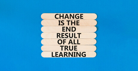 Change symbol. Concept words Change is the end result of all true learning on wooden stick. Beautiful blue table blue background. Copy space. Motivational business change result concept.