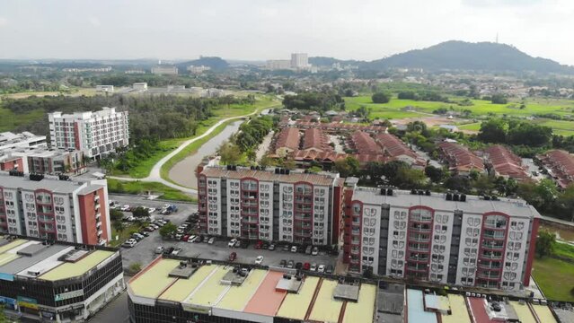 Drone view of beautiful modern buildings and greenery - moving backwards 