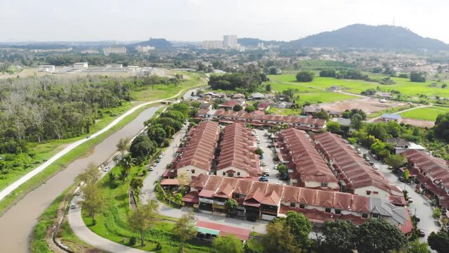Aerial view of beautiful modern small houses surrounded by greenery 