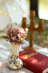 delicate lilac bouquet in a vase at a picnic