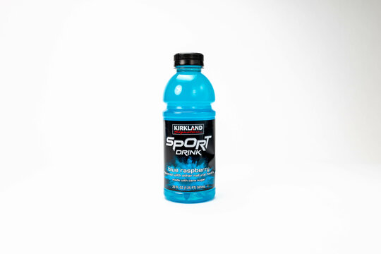 Fort Myers, FL, USA - 3-1-23: Kirkland signature branded Blue Raspberry Sport Drink Isolated on white.  Costco introduced Kirkland Signature as its private label in 1992. 