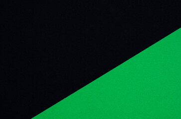 Colored geometric black and green paper texture background.