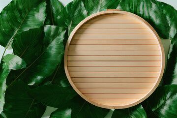 For product presentation, an empty circular wooden board is placed against a background of green tropical leaves, created by Artificial Intelligence.
