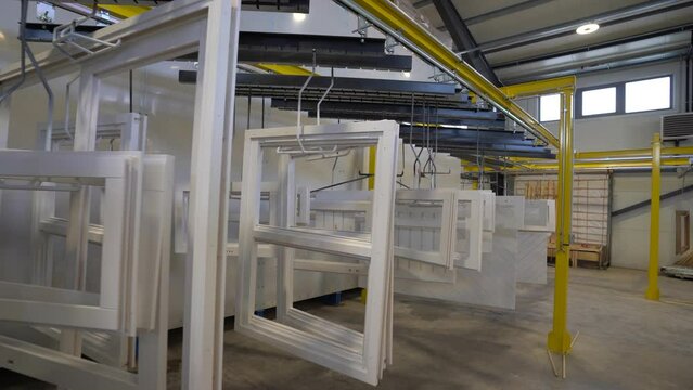 white windows and doors are waiting for painting in factory