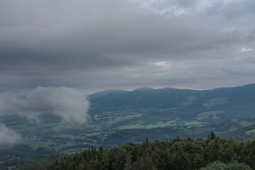 View from lookout tower Velky Javornik to Beskid Mountains in summer cloudy evening