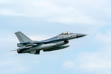 Military F16 fighter jet close up flying through the air. Royal Netherlands Air Force F16 fighter...