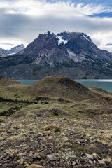 Impressive mountains and a lake with turquoise water at Torres del Paine National Park in Chile,...