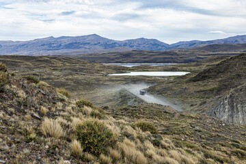 Driving through the huge and stunning National Park Torres del Paine in Chile, South America