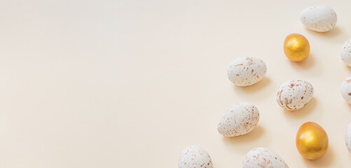 Easter composition with easter eggs on a beige background